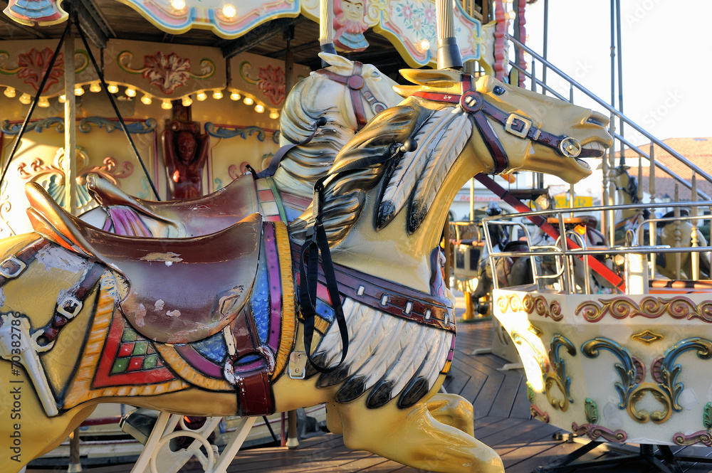 carousel with wooden horses
