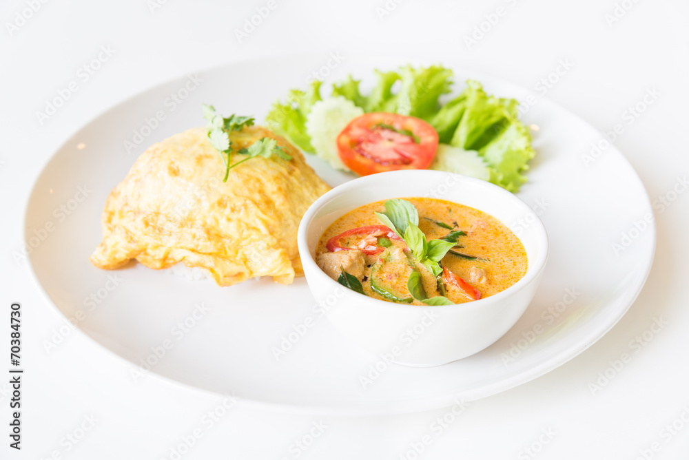 Delicious rice and red curry with pork and omelet (Thai panang c Delicious rice and red curry with pork and omelet (Thai panang c