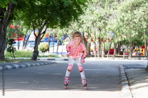 happy child girl roller skating