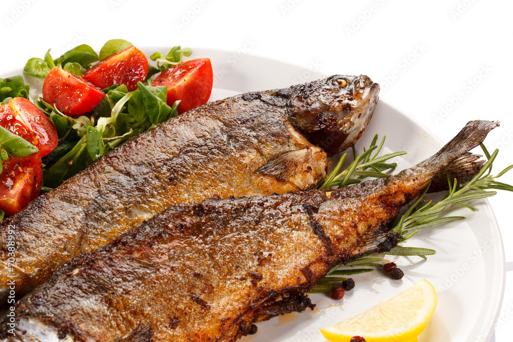 Fish dish - fried fish fillet with vegetables Fish dish - fried fish fillet with vegetables