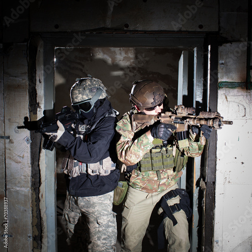 Special forces or contractor team during night mission/operation photo