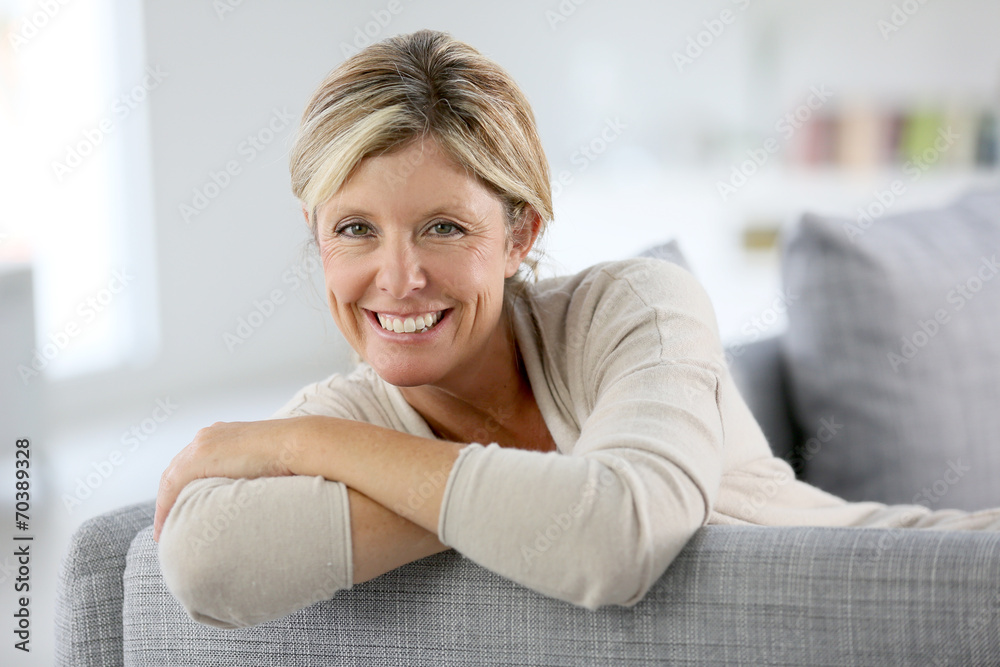 Beautiful 40-year-old woman relaxing in sofa Beautiful 40-year-old woman relaxing in sofa