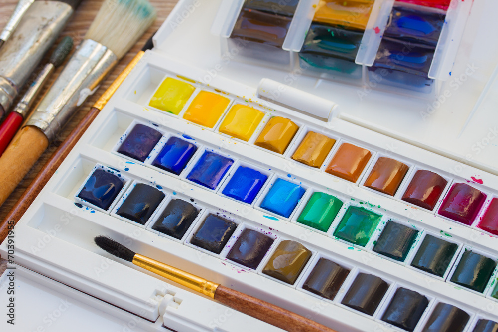 set of watercolor paints with brushes set of watercolor paints with brushes