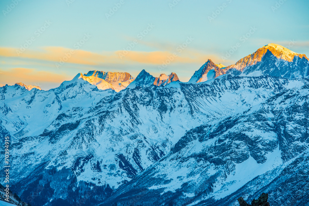 Snowy blue mountains in clouds - obrazy, fototapety, plakaty 