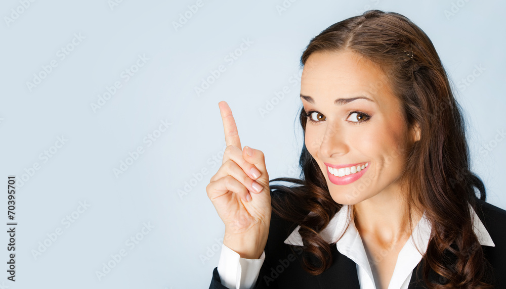 Businesswoman showing blank area for copyspace Businesswoman showing blank area for copyspace