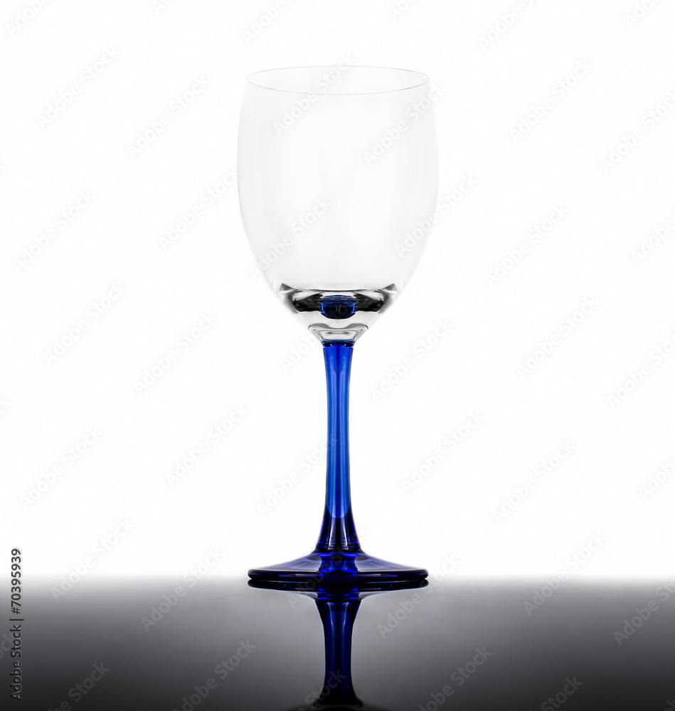 Empty wine glass on a white background with reflection Empty wine glass on a white background with reflection