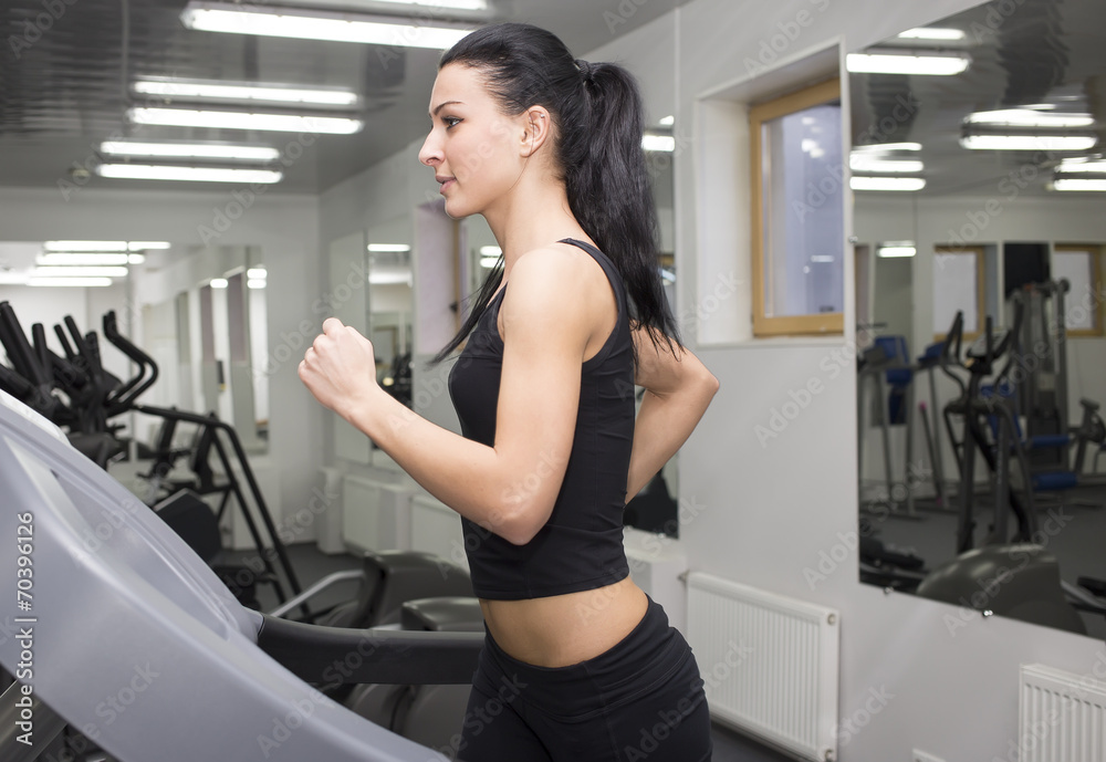 young girl goes in for sports in the gym