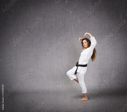 karate girl ready to hit in a profile side