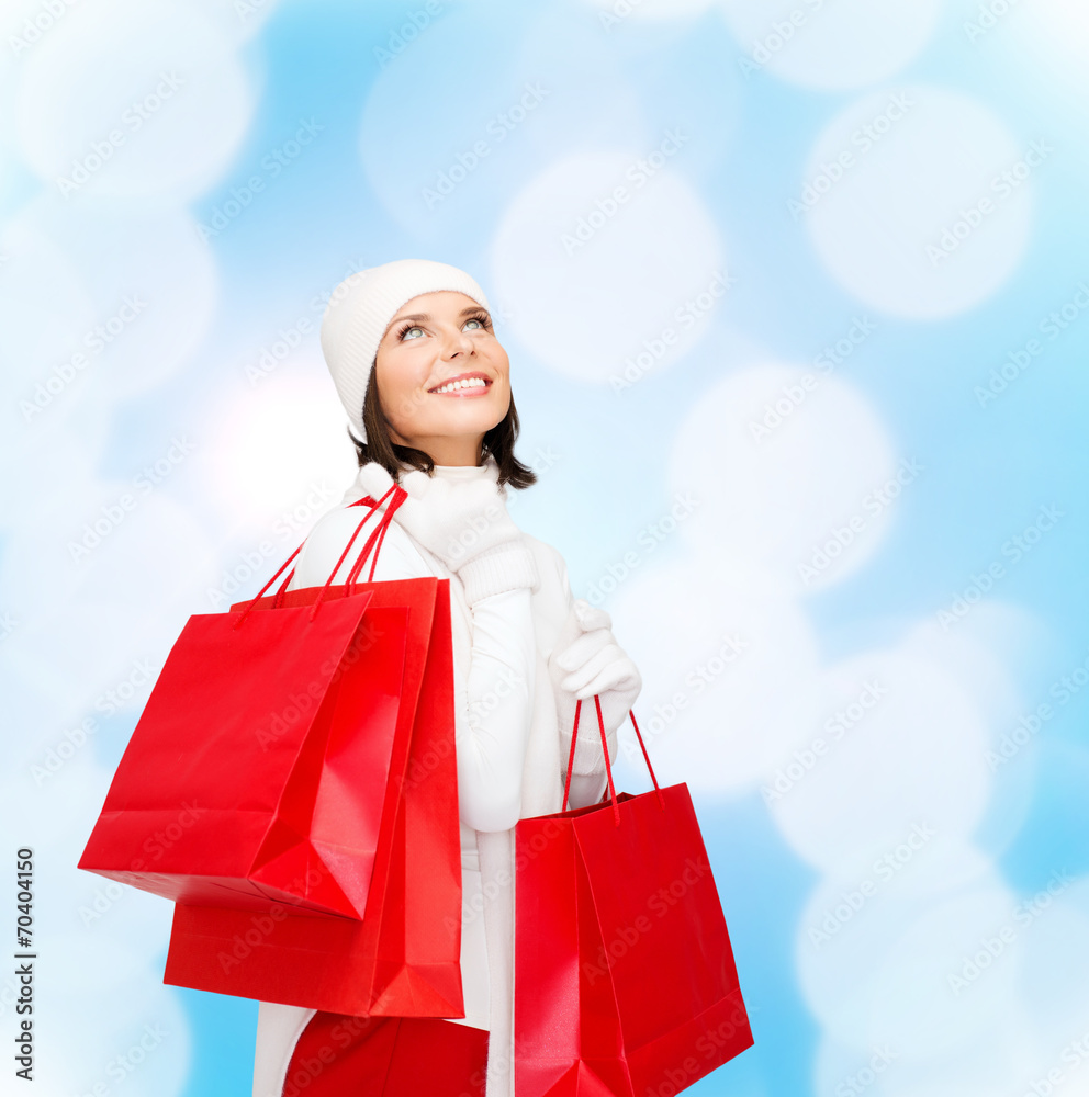 smiling young woman with red shopping bags smiling young woman with red shopping bags