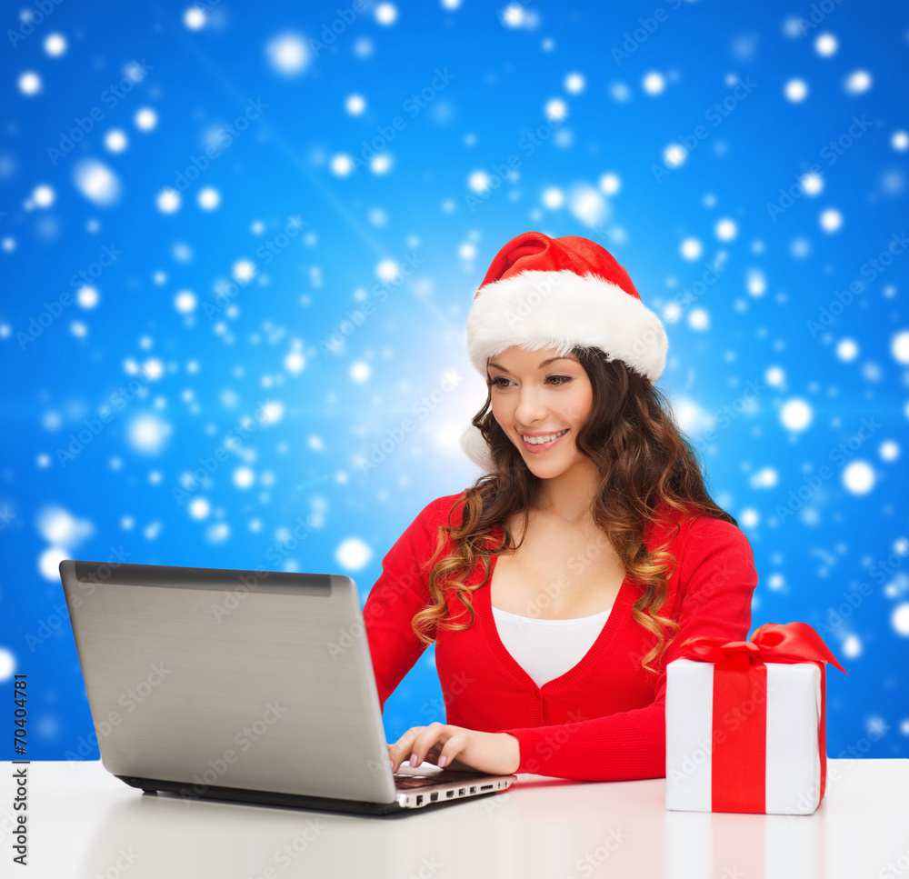 smiling woman with gift box and laptop smiling woman with gift box and laptop
