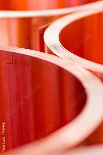 closeup of copper sheet in rolls from the selected focus
