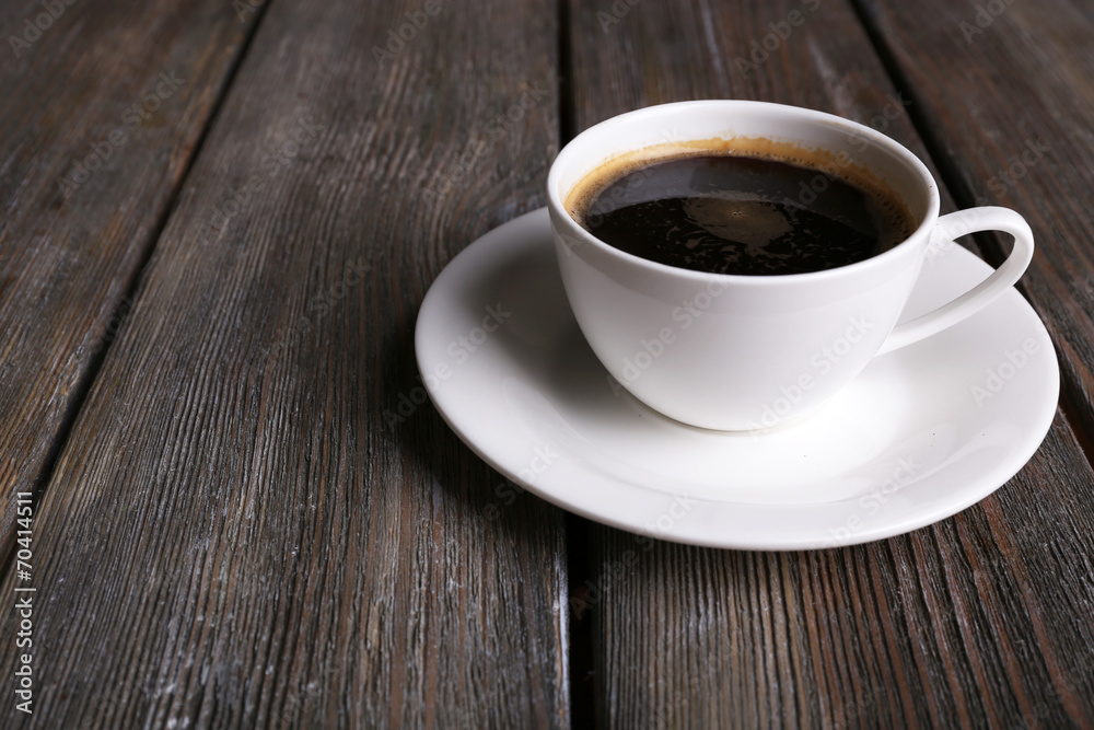 Cup of coffee on wooden background Cup of coffee on wooden background