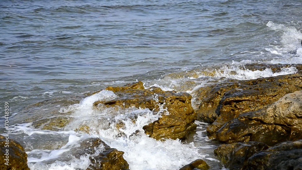 waves on sandy beach splach on the rocks waves on sandy beach splach on the rocks