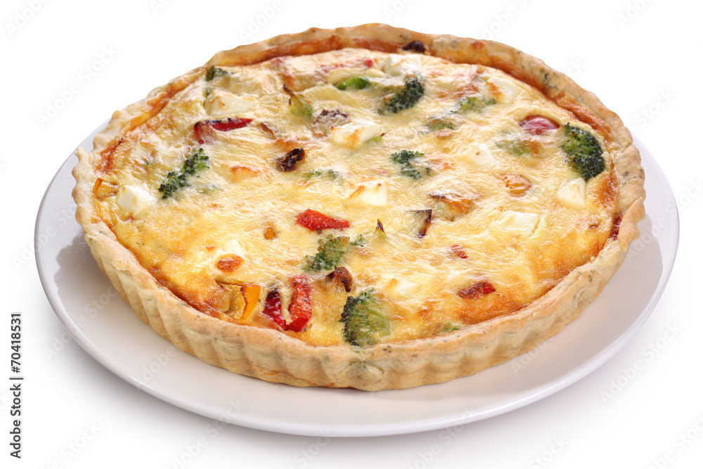 Quiche with broccoli and vegetables on a white plate.