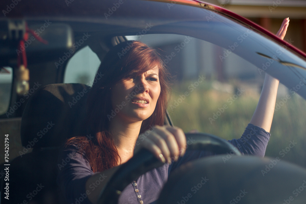 Fototapeta premium angry girl in the car