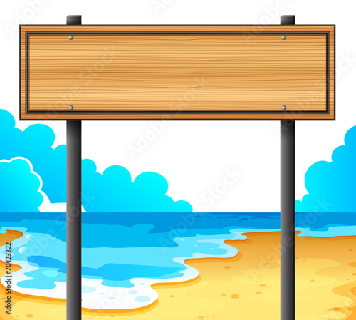 An empty wooden signboard at the beach
