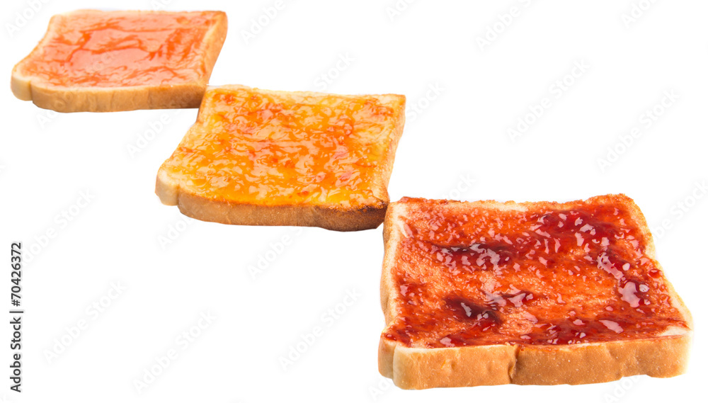 Mix fruit, blueberry, orange fruit jam spread on bread toast Mix fruit, blueberry, orange fruit jam spread on bread toast