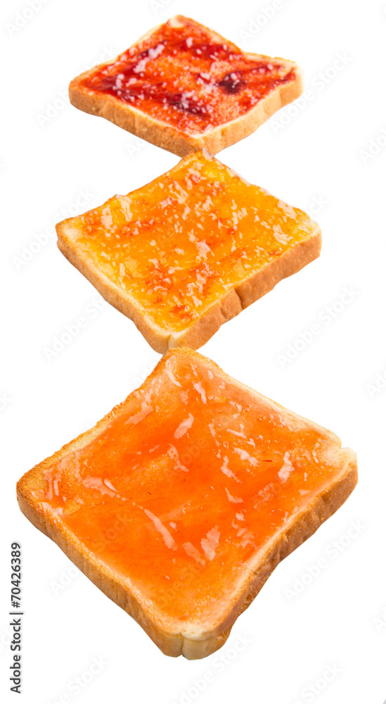 Mix fruit, blueberry, orange fruit jam spread on bread toast Mix fruit, blueberry, orange fruit jam spread on bread toast
