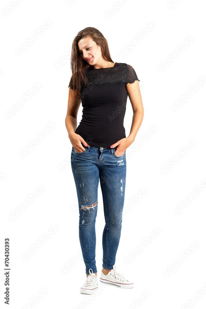 Standing beauty with hands in pockets Standing beauty with hands in pockets