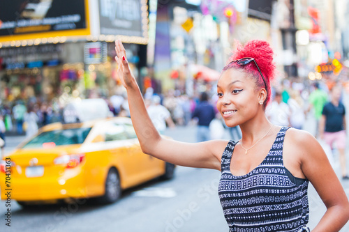 Beautiful Young Woman Calling a Cab in New York