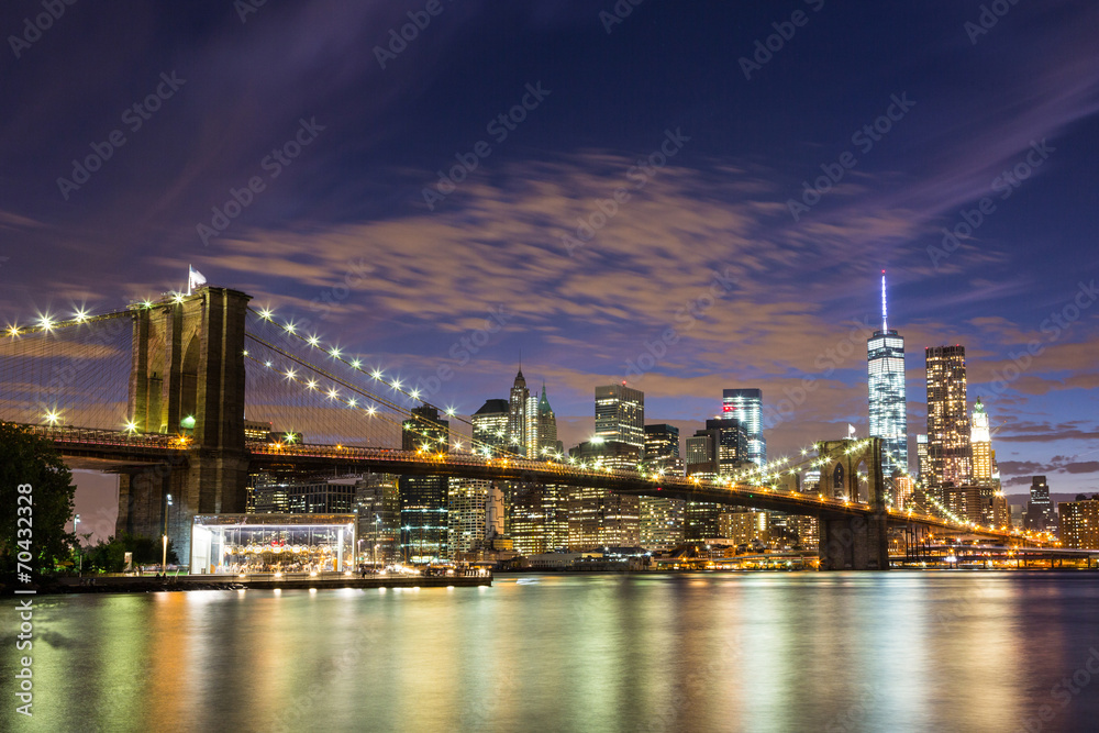 Brooklyn Bridge and Downtown Skyscrapers in New York at Dusk