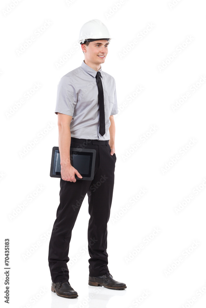 Smiling engineer holding a digital tablet. Smiling engineer holding a digital tablet.