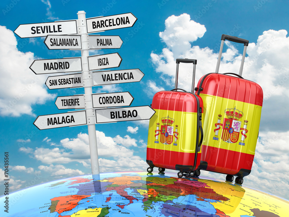 Travel concept. Suitcases and signpost what to visit in Spain - obrazy, fototapety, plakaty 