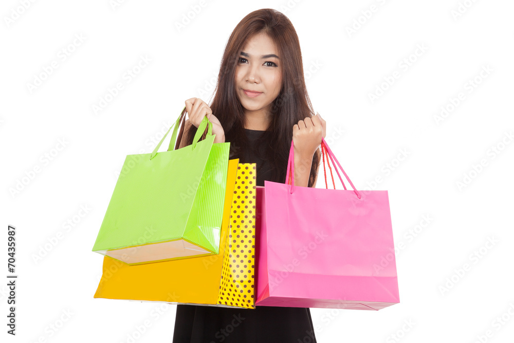 Beautiful Asian woman smile with shopping bags in both hands Beautiful Asian woman smile with shopping bags in both hands