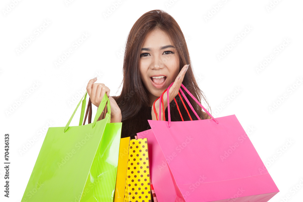 Beautiful Asian woman excited with shopping bags in both hands Beautiful Asian woman excited with shopping bags in both hands