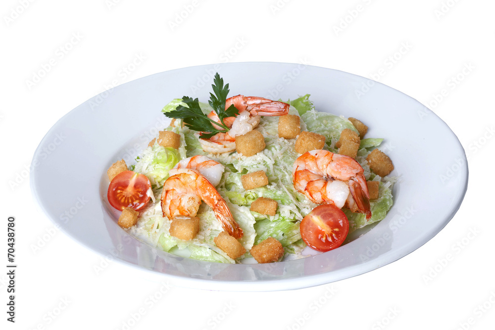 Caesar salad with shrimp on a plate