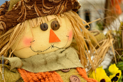 scarecrows with flowers and hay