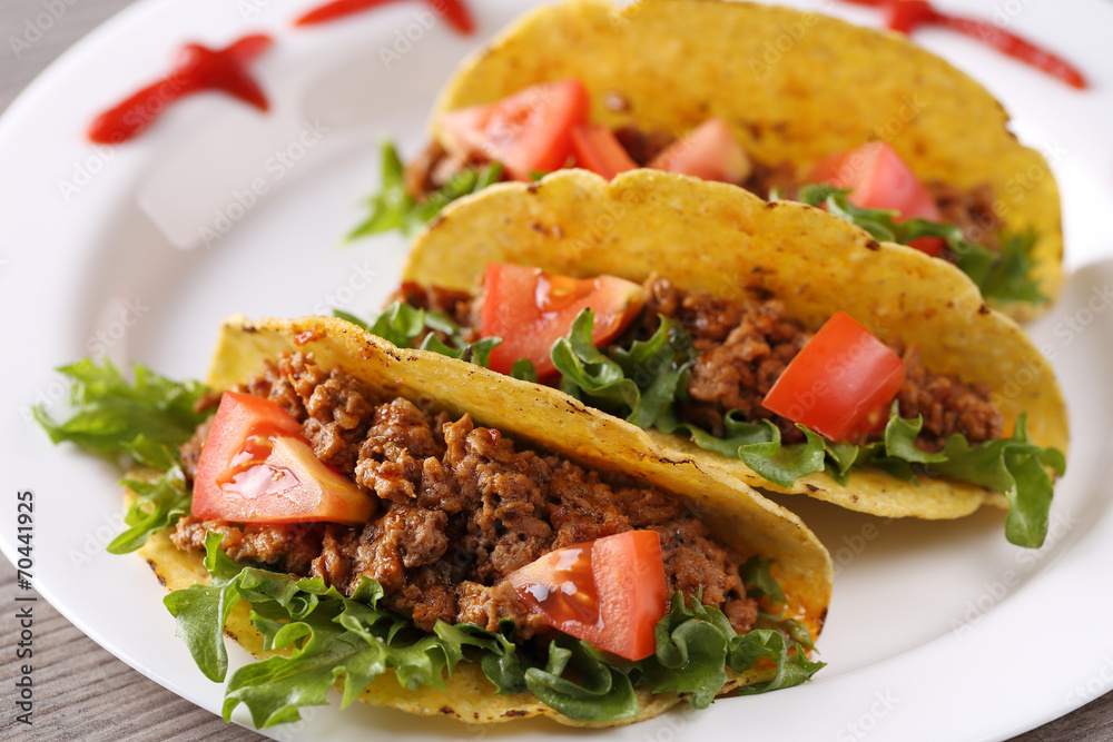three taco shells on the plate three taco shells on the plate