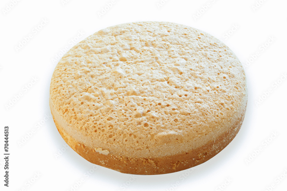 Baked cake just cooling before decorating isolated in white Baked cake just cooling before decorating isolated in white