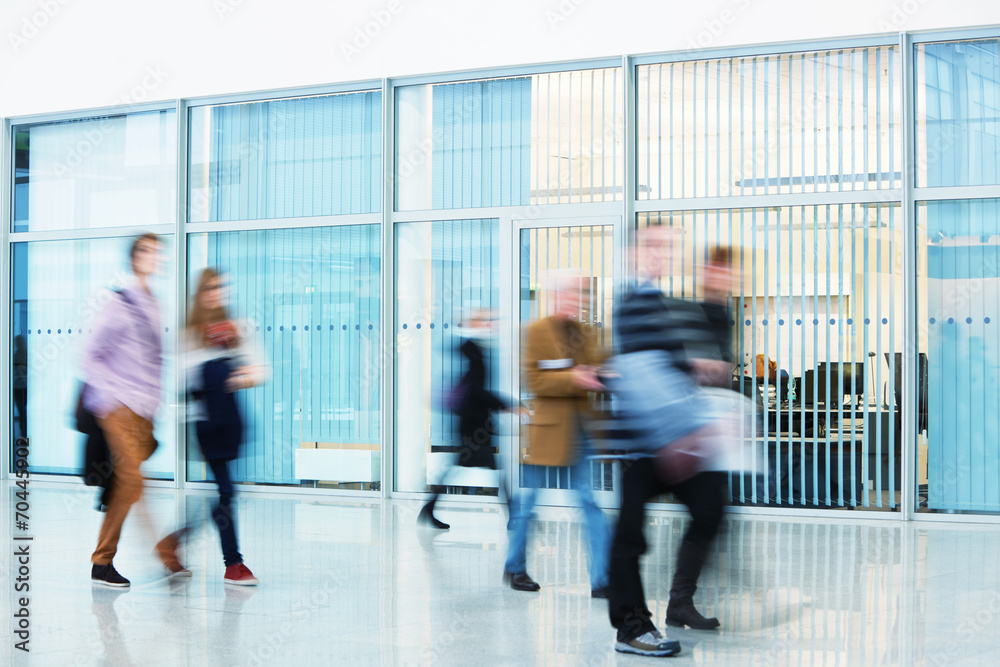 Silhouettes of People Walking in Office Building