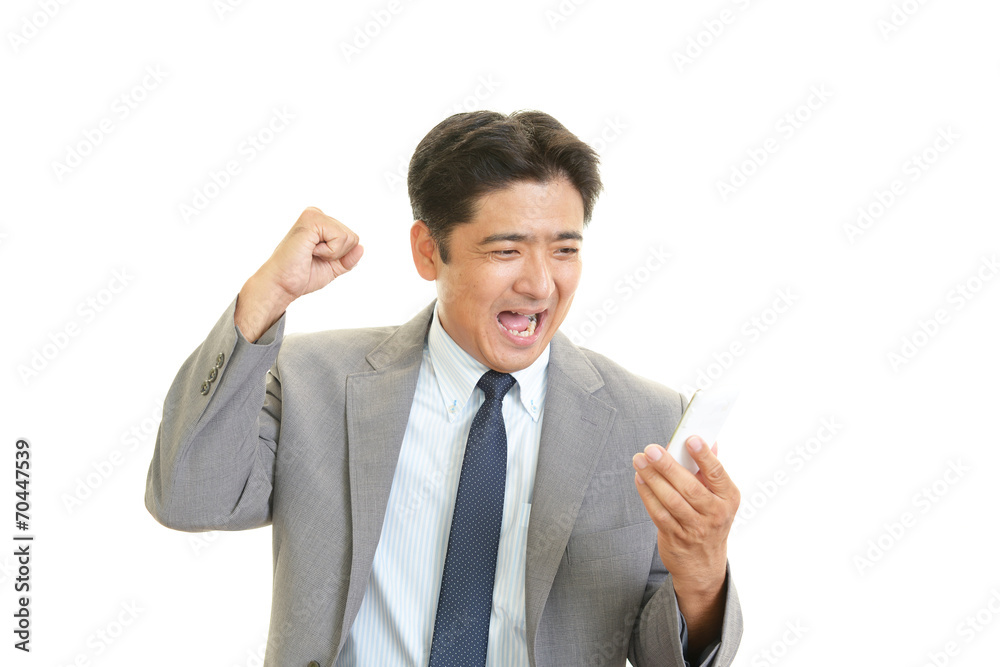 ガッツポーズのビジネスマン