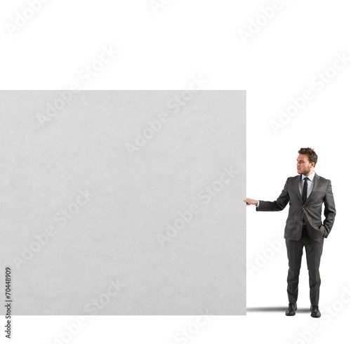 Businessman holds a blank billboard © alphaspirit