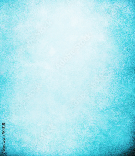 abstract blue background or dark paper with bright center spotli