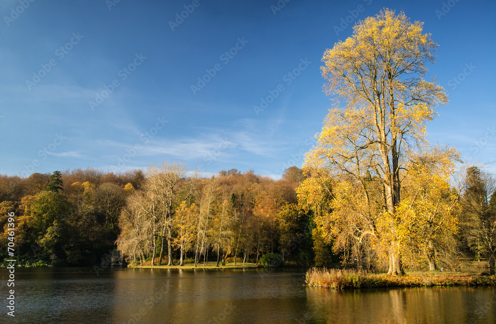 Trees and main lake in Stourhead Gardens during Autumn. Trees and main lake in Stourhead Gardens during Autumn.