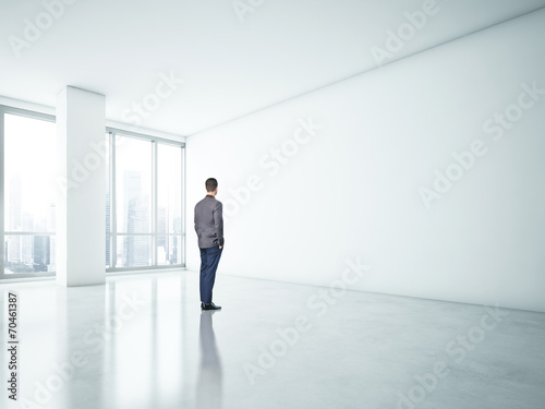 Man looking at white wall