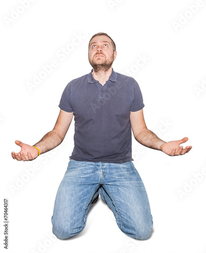 desperate young man on his knees