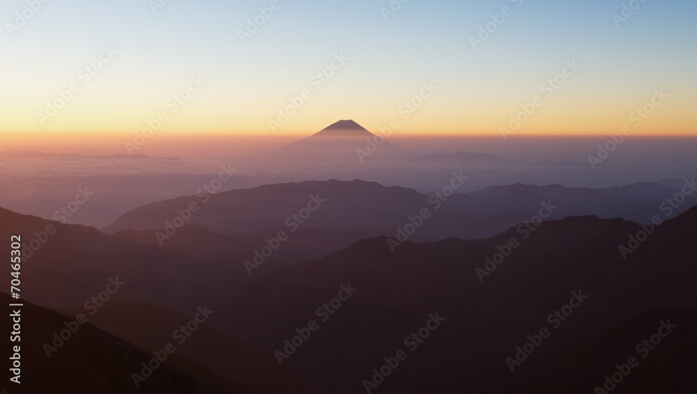 Top of Mountain Fuji with fog and cloud in early summer morning