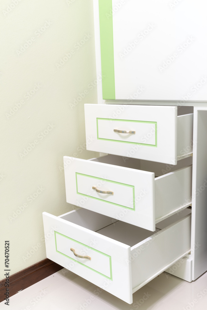 3 white drawer with some green line 3 white drawer with some green line