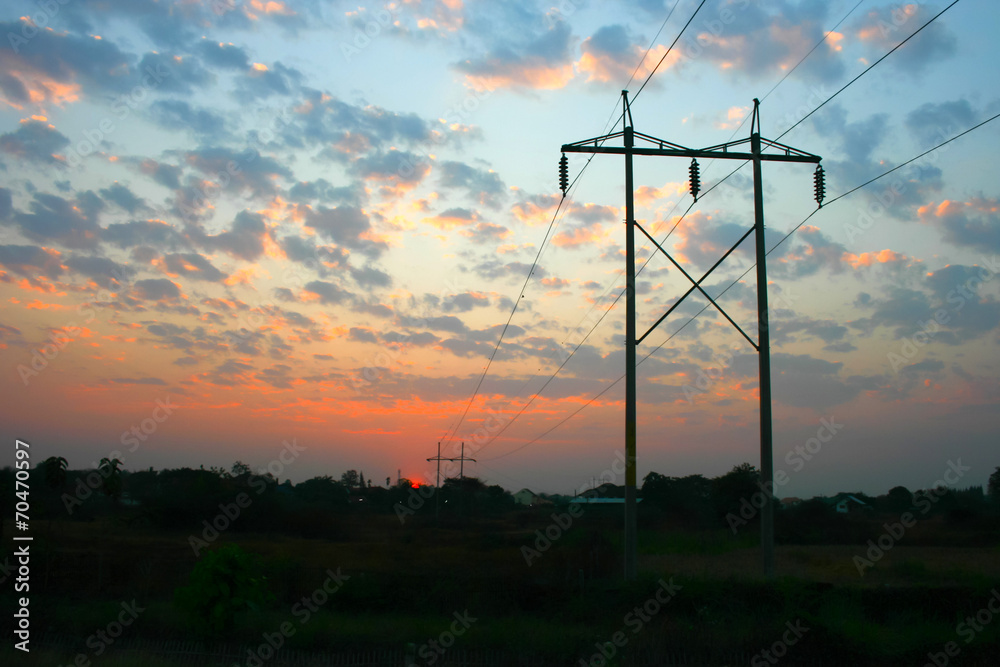 Obraz premium transmission power line on sunset