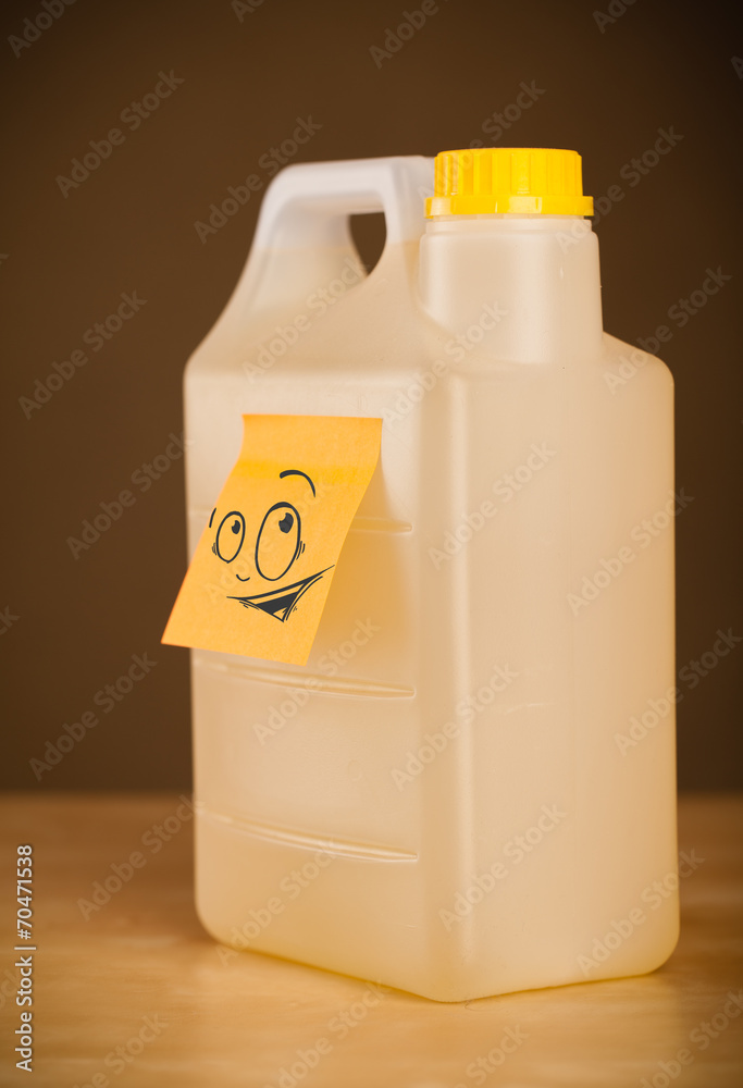 Post-it note with smiley face sticked on can
