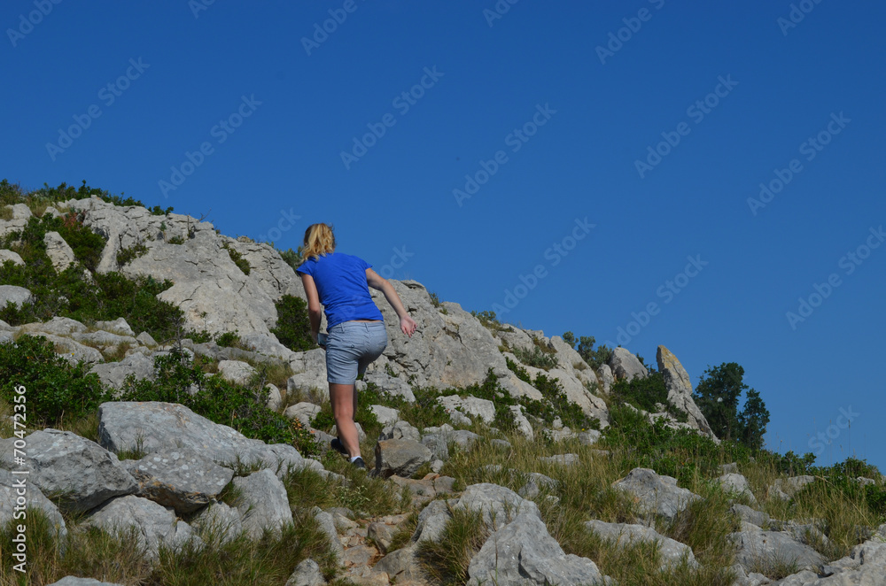 girl walking up mountain