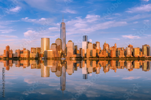 Manhattan at sunset reflected in the hudson river