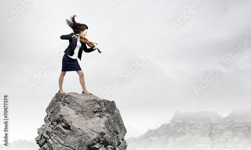 Businesswoman with violin © Sergey Nivens