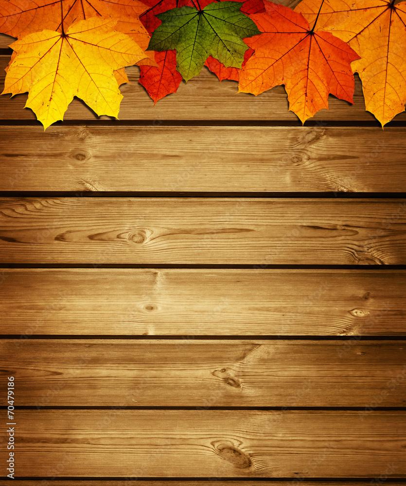 wooden background with autumn maple leaves wooden background with autumn maple leaves