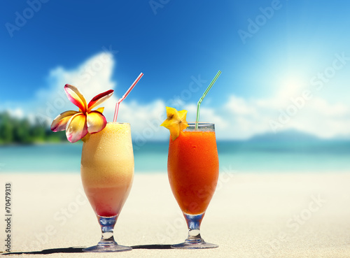 fresh fruit juices on a tropical beach