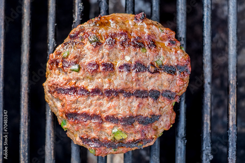 Hamburgers on the grill with stripes outdoors